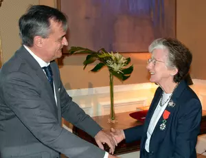 Dr. Rita Colwell accepting her 'Chevalier de la Legion d'Honneur' from the Ambassador of France, to the United States, Gerard Araud